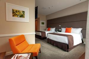 Krevet ili kreveti u jedinici u objektu Paseo La Galería Hotel & Suites