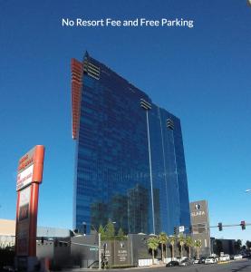 a tall blue building with a lot of windows at Suites at Elara Las Vegas Strip-No Resort Fees in Las Vegas