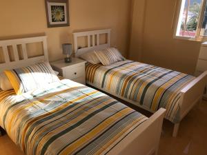 Postel nebo postele na pokoji v ubytování Miramar 2