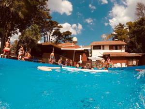 a group of people in the water at a swimming pool at Hotel Villa Santa Maiani in Mar del Plata