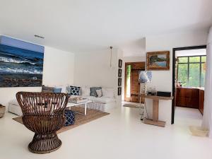a living room with a couch and a table at Villa Riviera in Cannes