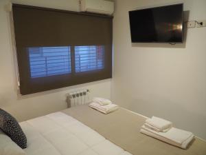 Cama ou camas em um quarto em Umbral del Aconcagua