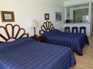 Postel nebo postele na pokoji v ubytování Salvia Cancun Aparts