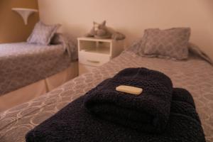Säng eller sängar i ett rum på La casa del eucaliptus