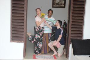 a group of three people standing in a room at Miheen Hotel & Resort - Anuradhapura in Mihintale