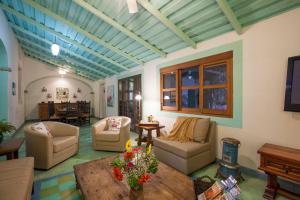 a large living room with couches and a table at Casa Abuelita: An exquisite, historic La Paz home in La Paz