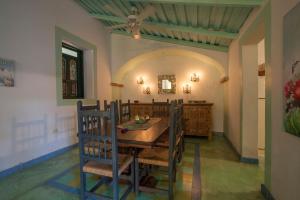 a dining room with a wooden table and chairs at Casa Abuelita: An exquisite, historic La Paz home in La Paz