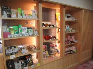 a store filled with lots of products on shelves at Ryokan Yukeikohan Suitenkaku in Matsue