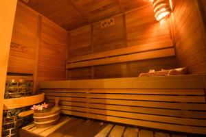 a sauna with wooden walls and a wooden floor at Boracay Haven Suites in Boracay