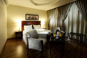 Кровать или кровати в номере Aswar Hotel Suites