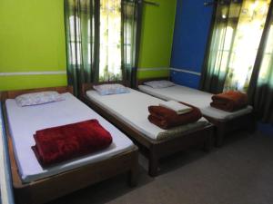 Postel nebo postele na pokoji v ubytování Vamoose Latpanchor Homestay