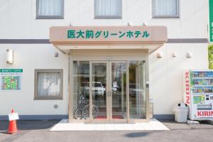 an entrance to a building with a glass door at Saga Idaimae Green Hotel in Saga