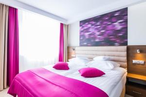 Postel nebo postele na pokoji v ubytování Hotel IKAR