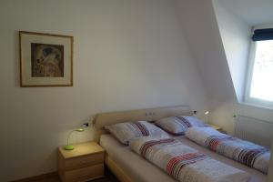 a bedroom with two beds and a window at Hager Apartment 2 in Merano