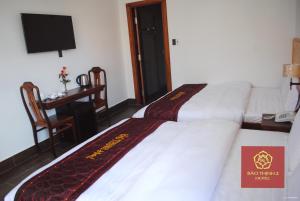 Voodi või voodid majutusasutuse Bảo Thịnh 2 Hotel toas