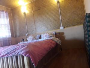 Letto o letti in una camera di Vamoose Soshing Homestay