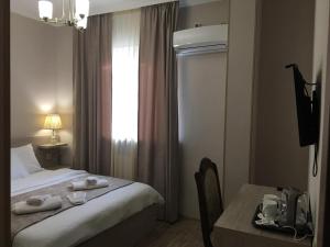 Voodi või voodid majutusasutuse Family Hotel Triston toas