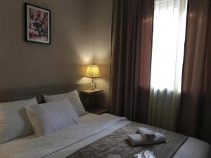 Voodi või voodid majutusasutuse Family Hotel Triston toas