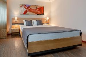 Rubicon Garni Hotel客房内的一张或多张床位