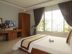 TV a/nebo společenská místnost v ubytování Green Hotel