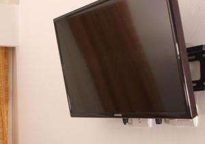 TV a/nebo společenská místnost v ubytování Hostal San Francisco de Asis