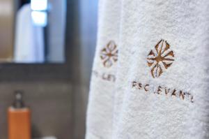 a towel with the words rbc energy on it at Corso Levante Luxury Suites in Petrovac na Moru