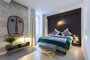 Postel nebo postele na pokoji v ubytování L'Abeille - Boutique Apartments