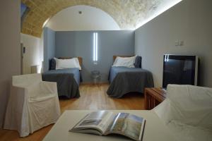 Postel nebo postele na pokoji v ubytování Il Carrubo residenza Walk&Stay