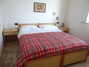 A bed or beds in a room at Villetta in collina a due passi dal mare