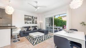 a living room with a couch and a table at Torres de Cala Pi in Cala Pi