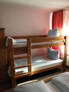 a bunk bed room with two bunk beds at Hotel Guntia Boardinghouse in Günzburg