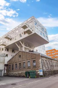 a building with a cube on the top of it at BJØRVIKA APARTMENTS, Damsgård Area, Bergen city center in Bergen +89 photos