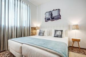 Postel nebo postele na pokoji v ubytování Loulé Coreto Guesthouse