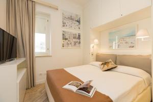 A bed or beds in a room at Amazing Penthouse Piazza Venezia