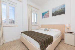 A bed or beds in a room at Amazing Penthouse Piazza Venezia