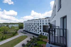 a view of a building from a balcony at P&O Apartments Zawiszy in Warsaw