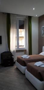 Posteľ alebo postele v izbe v ubytovaní Mia Suites