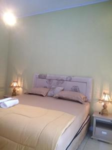 Postel nebo postele na pokoji v ubytování Three V Homestay