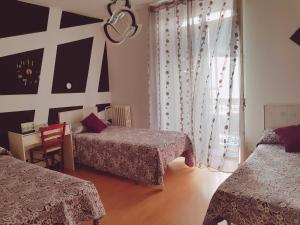 Postel nebo postele na pokoji v ubytování Hostal Lima