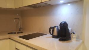 a coffee maker sitting on a counter in a kitchen at Charming Apartment I Historical Center in Lisbon