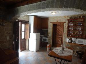 A kitchen or kitchenette at Rosalia Apartments