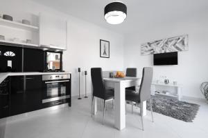 Kuchyň nebo kuchyňský kout v ubytování Luxury Apartment Bella