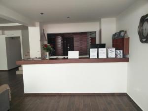 a white counter in a room with a fireplace at New York Hotel in Rhodes Town