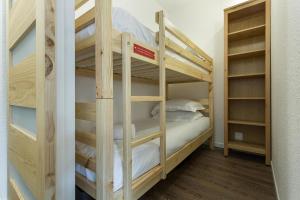 a couple of bunk beds in a room at Apartment Balme 5 in Chamonix