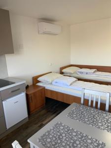 Postel nebo postele na pokoji v ubytování Apartman Decorus
