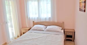 Postel nebo postele na pokoji v ubytování Villa Lily