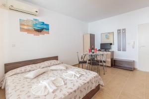 Postel nebo postele na pokoji v ubytování Aparthotel Costa Calma
