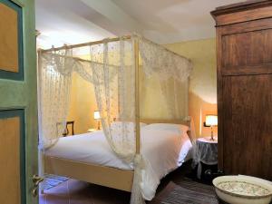 Posteľ alebo postele v izbe v ubytovaní SIENA ROMANTIC EXPERIENCE