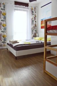 a bedroom with a bed and a window at Sopotinn Apartment in Sopot