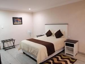 Ένα ή περισσότερα κρεβάτια σε δωμάτιο στο Kanyane Lodge